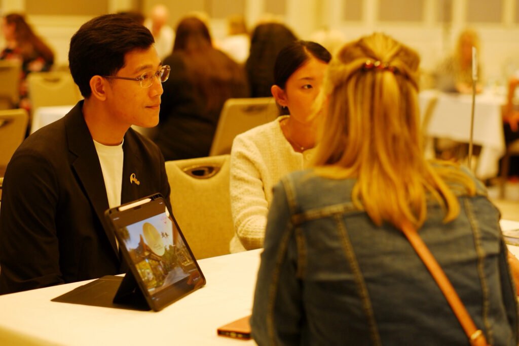 Thai seller meets with a UK travel trade representative during a business session.