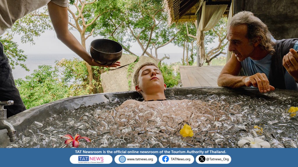 Traveller experiences an ice bath wellness treatment at a tropical Thai resort, highlighting Thailand’s longevity tourism and restorative travel offerings.