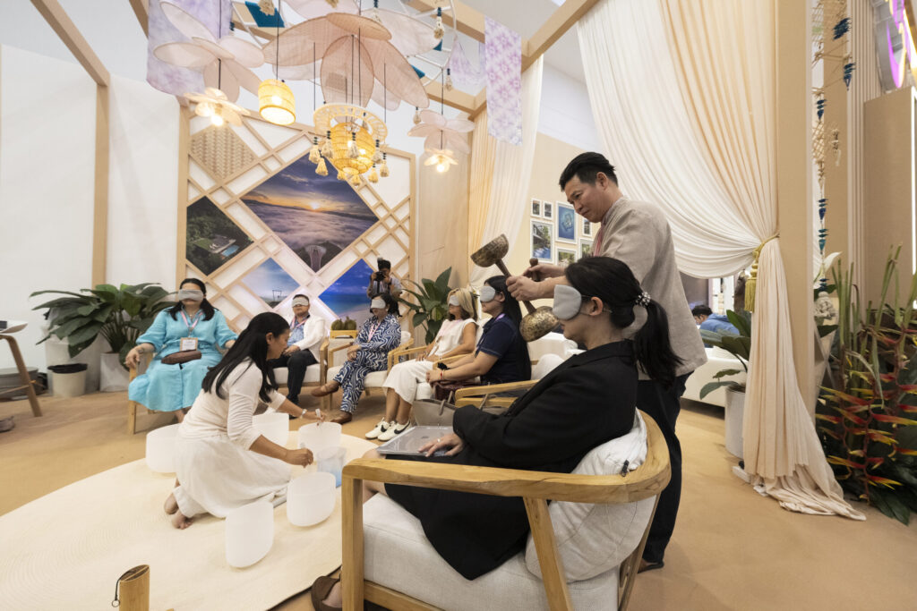 Visitors join a Thai sound therapy wellness experience at the TTM+ 2026 pavilion.