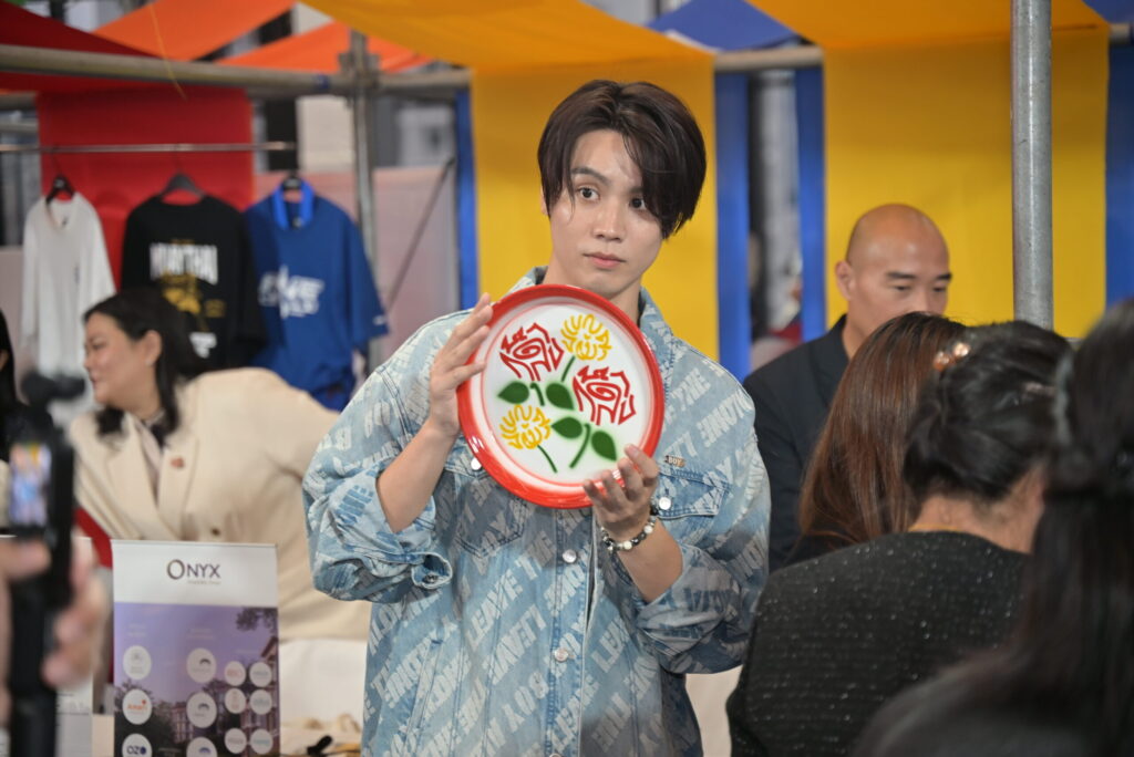 Traveller representative showcases a Thai-designed product at the Amazing Thailand Grand Sale 2026 event.