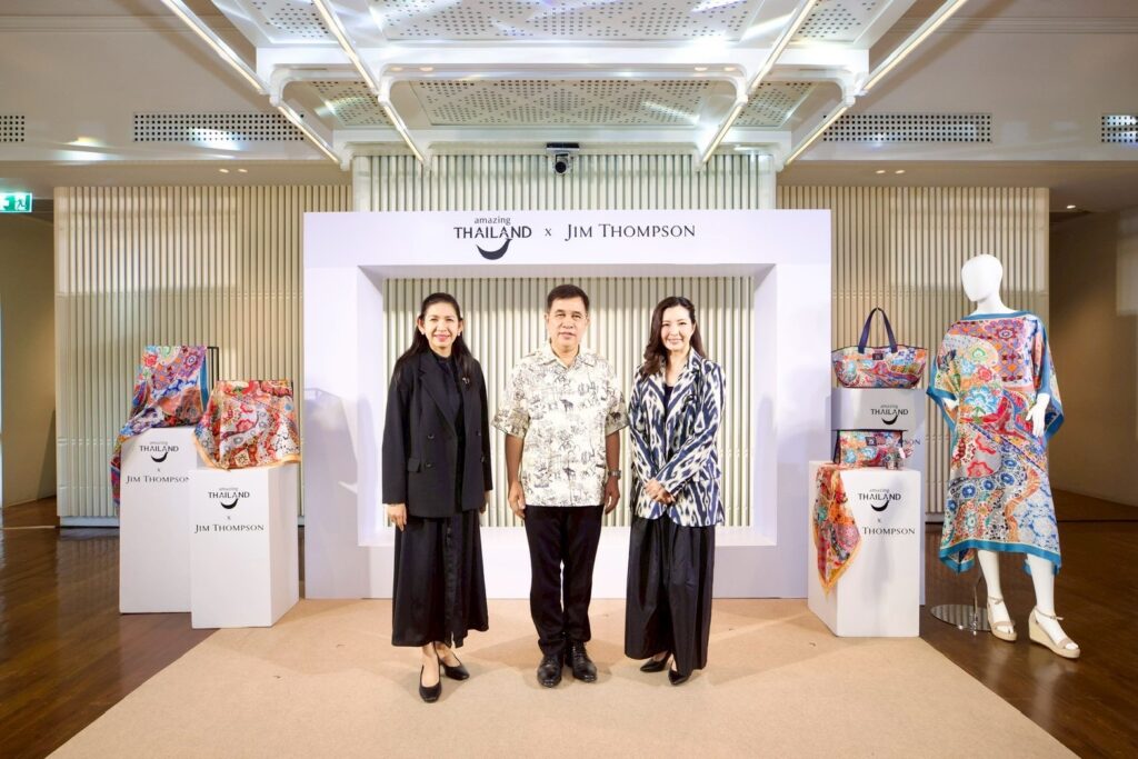 TAT and Jim Thompson executives pose with Thai silk pieces from the Amazing Thailand x Jim Thompson collection