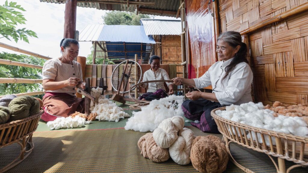 Local artisans prepare cotton yarn at Ban Khan Tha Kwian, Ubon Ratchathani, showcasing Isaan community-based tourism.