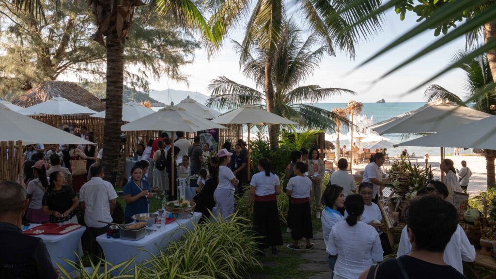 Wellness market and local experiences welcome visitors at a beachside Global Wellness Day 2026 event in Ko Samui.