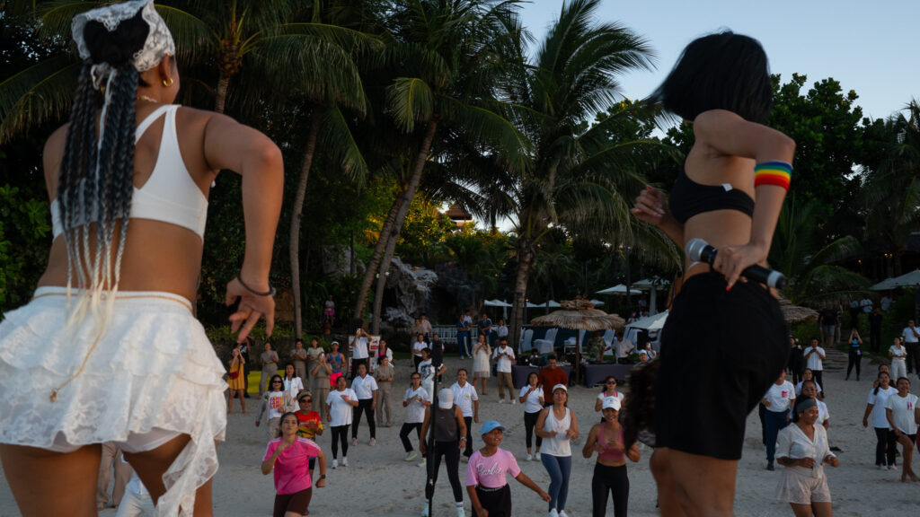Visitors enjoy joyful movement and beach activities during Global Wellness Day 2026 in Ko Samui.