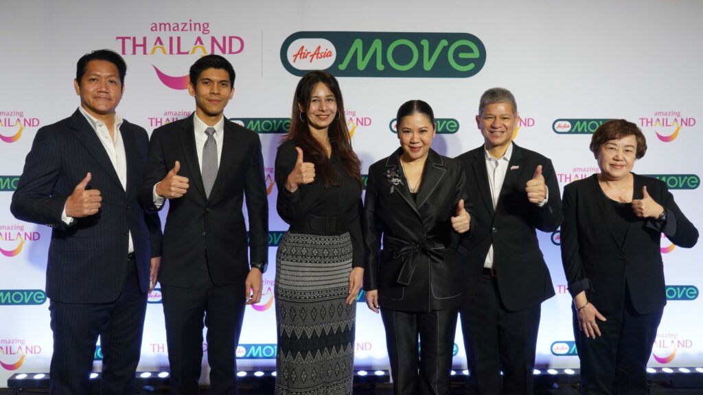 2. TAT and AirAsia MOVE representatives give thumbs up at the three-year MOU signing event to promote Thailand travel.