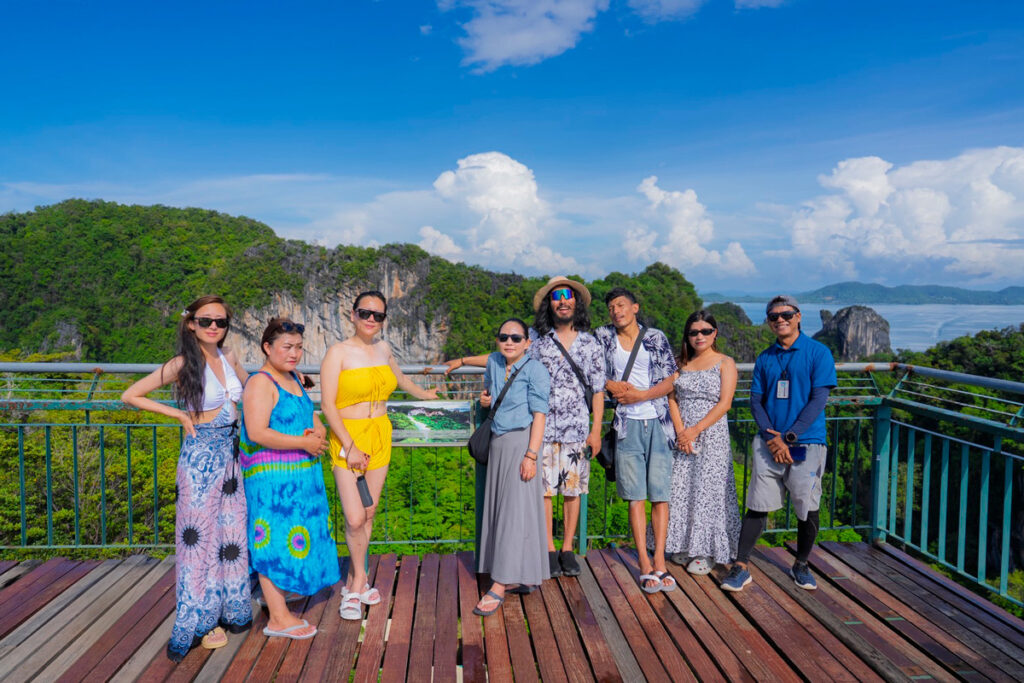 Bhutanese delegates visit a viewpoint overlooking Krabi’s limestone cliffs and sea.