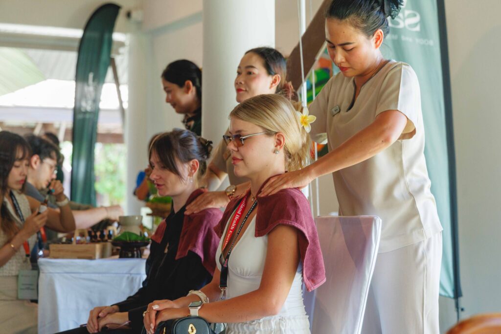 Wellness therapists provide shoulder massage during Thailand Surf Therapy 2026 in Phang-nga.
