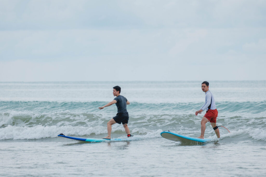 Participants practise surfing as part of Thailand Surf Therapy on the Phang-nga coast.