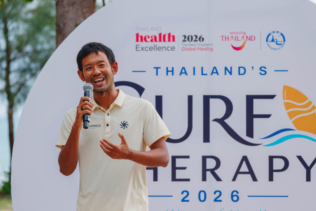 Surf instructor speaks during Thailand Surf Therapy 2026 beachside wellness programme.
