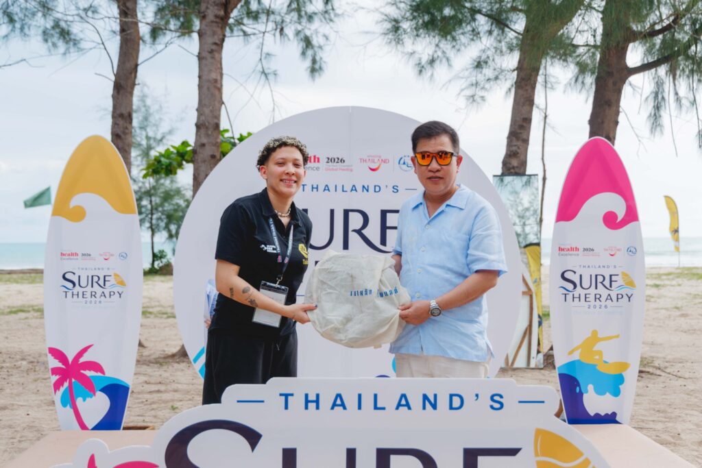 International surf therapy partner receives a welcome gift at Thailand Surf Therapy 2026 in Phang-nga.