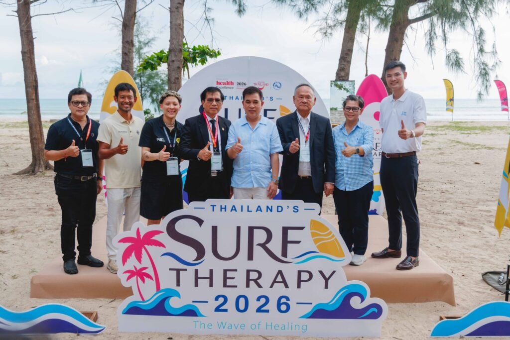 TAT officials and partners mark Thailand Surf Therapy 2026 on a beach in Phang-nga.