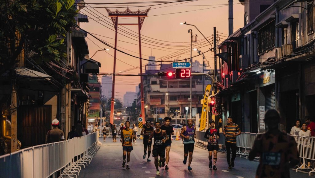 Runners pass the Giant Swing at sunrise during the Amazing Thailand Marathon Bangkok.