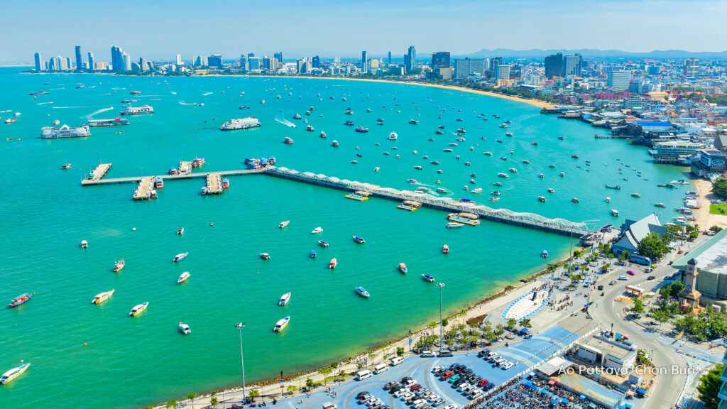 Aerial view of Ao Pattaya with turquoise waters, boats, Bali Hai Pier and Pattaya’s coastal skyline in Chon Buri.