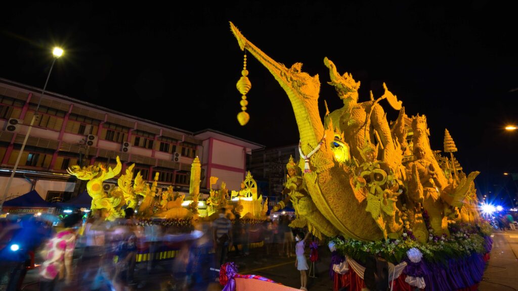 Illuminated candle floats glow during a night-time display at the Ubon Ratchathani Candle Festival.