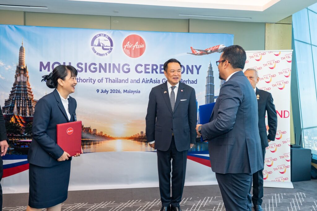 TAT and AirAsia Group representatives speak with Thai officials following the three-year tourism partnership signing in Malaysia.