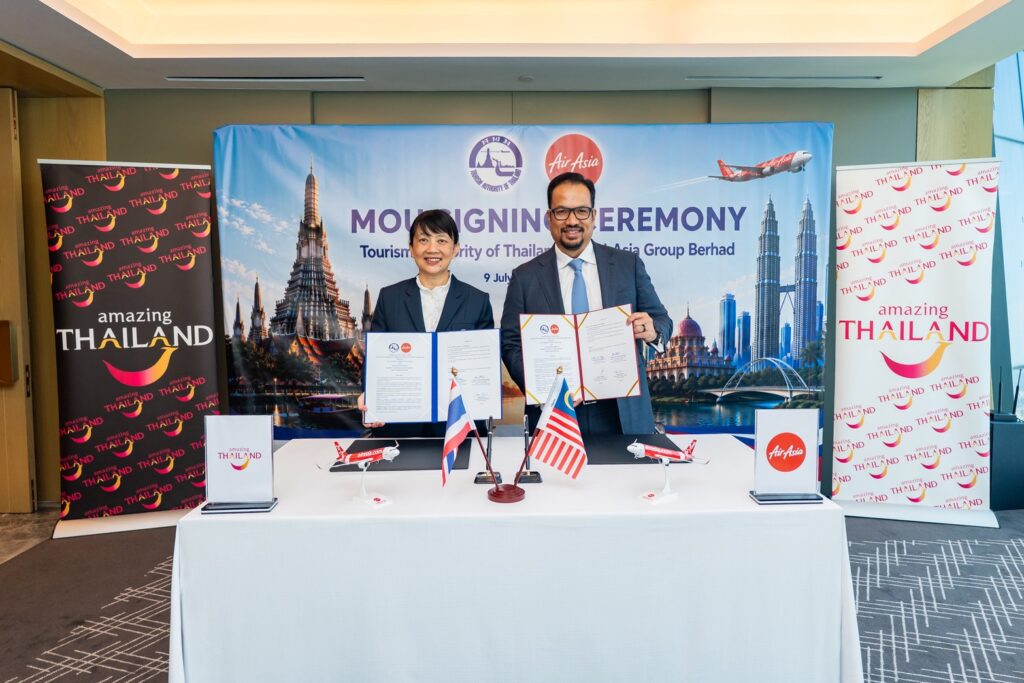 TAT and AirAsia Group signatories present the completed MOU supporting joint marketing, connectivity, and regional tourism growth.