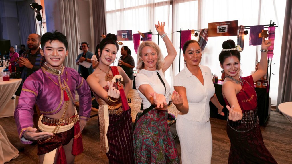 Fam trip participants join Isan performers during the Ubon Ratchathani welcome reception.