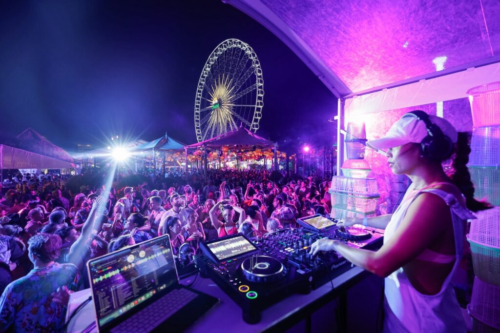 DJ performs for delegates at Flight Fest at Asiatique The Riverfront in Bangkok.