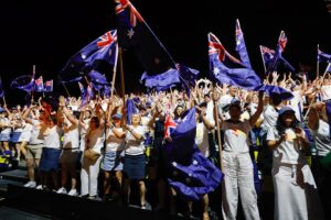 Flight Centre Global Gathering Bangkok 2026 delegates celebrate while waving Australian flags.