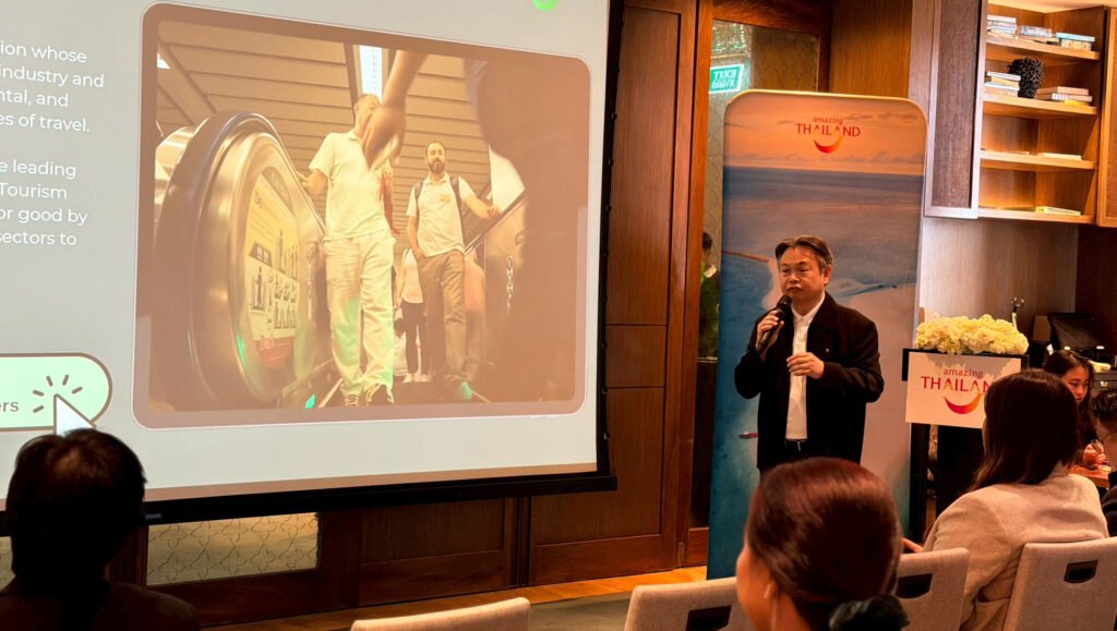 Speaker presents long-haul travel market insights at the TAT Communities ConNext workshop in Bangkok.