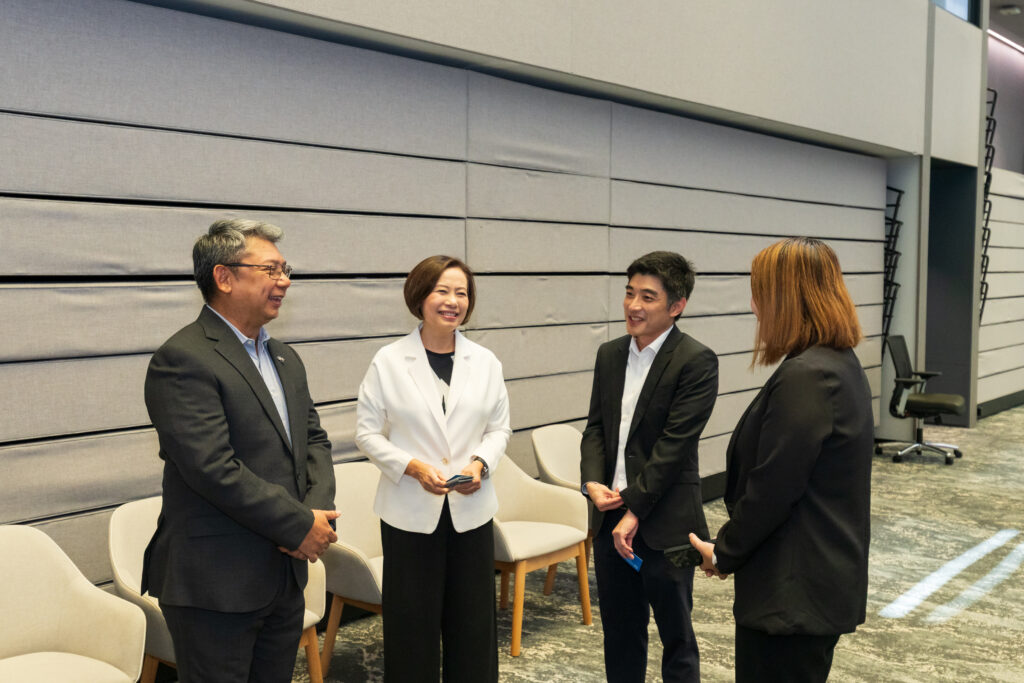 TAT Deputy Governor Nithee Seeprae speaks with UOB representatives at the Travel Thailand Together campaign launch.