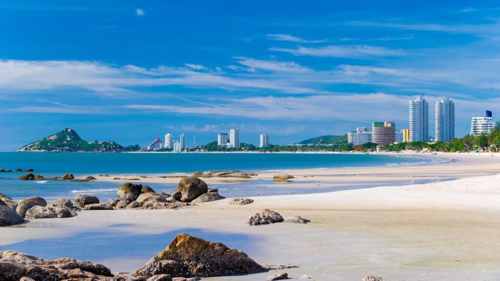 Panoramic view of Hua Hin Beach, rocky shoreline and the coastal skyline