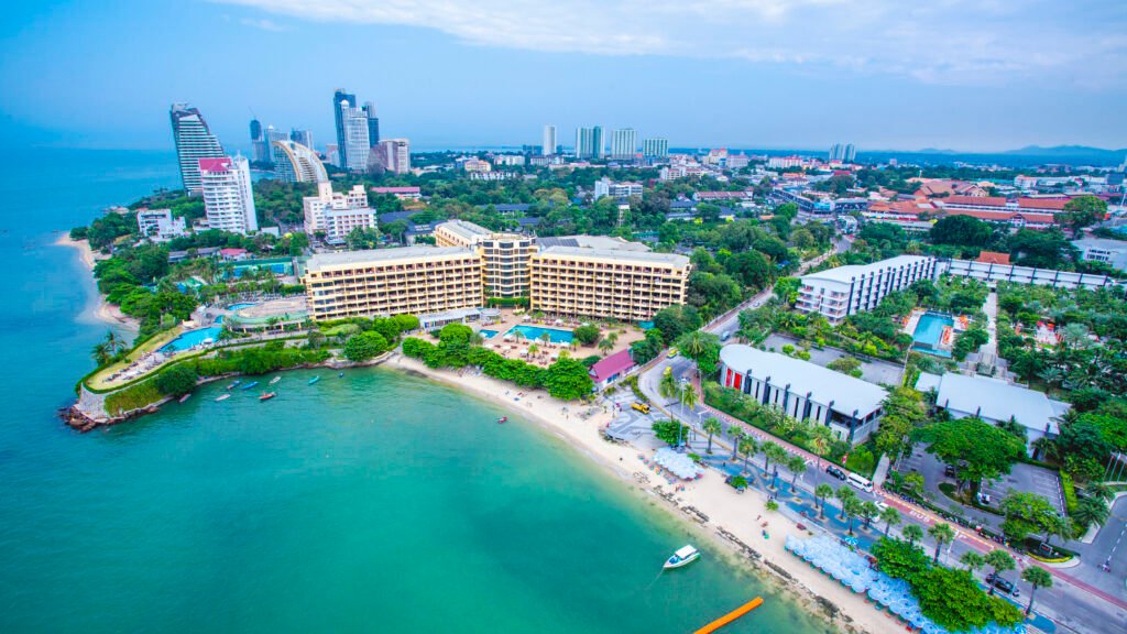 Aerial view of Pattaya’s beachfront, coastal hotels and turquoise sea featured in Running Man Thailand.