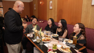 Guests enjoy Thai cuisine and conversation at the Wholesome Taste of Thai networking event in Jakarta.