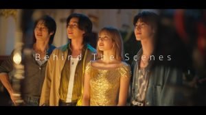 LISA in golden Thai-inspired gown with cast in “feel all the feelings” behind-the-scenes video, showcasing Thai fashion and cultural storytelling