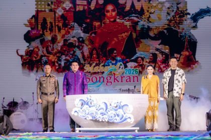 Opening ceremony of Maha Songkran World Water Festival 2026 at Benchakitti Park, Bangkok, with officials on stage beside a ceremonial water bowl against the festival backdrop.