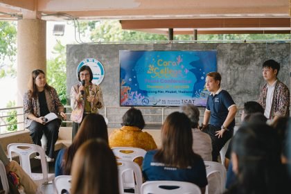 Speaker presents Coral College initiative at Chalong Pier, Phuket press conference, 24 July 2025.