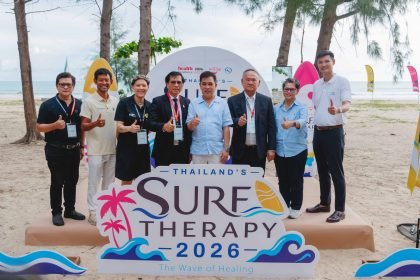 TAT officials and partners mark Thailand Surf Therapy 2026 on a beach in Phang-nga.