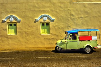 The unique frog-head tuk-tuk and Sino-Portuguese building in Trang city