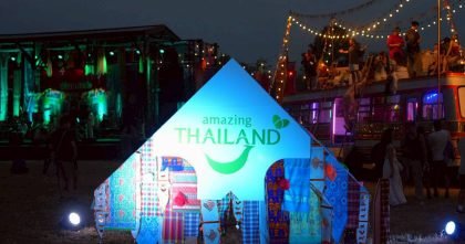 Amazing Thailand pavilion illuminated at Wonderfruit 2025, showcasing TAT’s presence within the festival’s night-time cultural and music setting in Chon Buri.